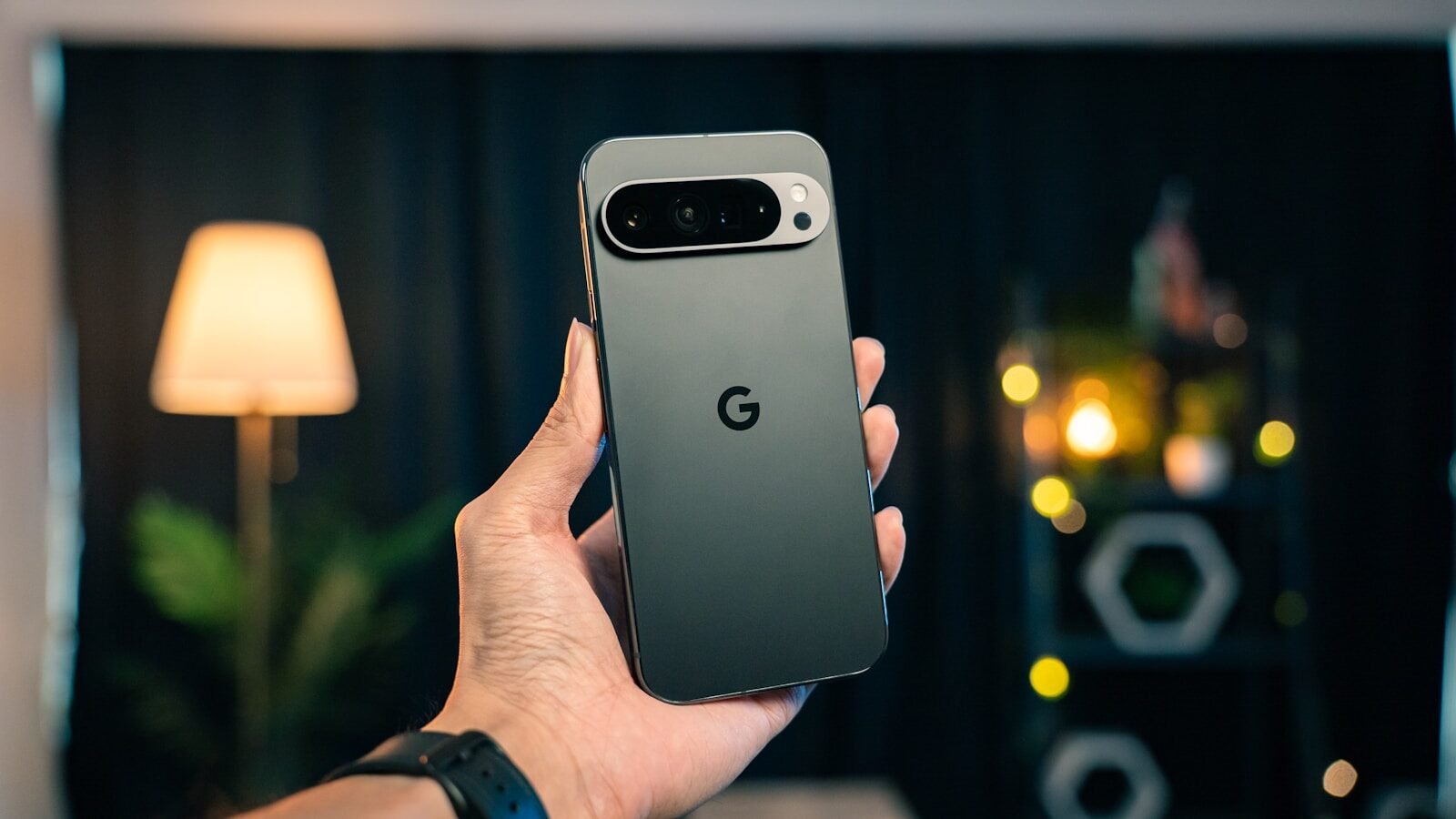 A person holding a cell phone in their hand