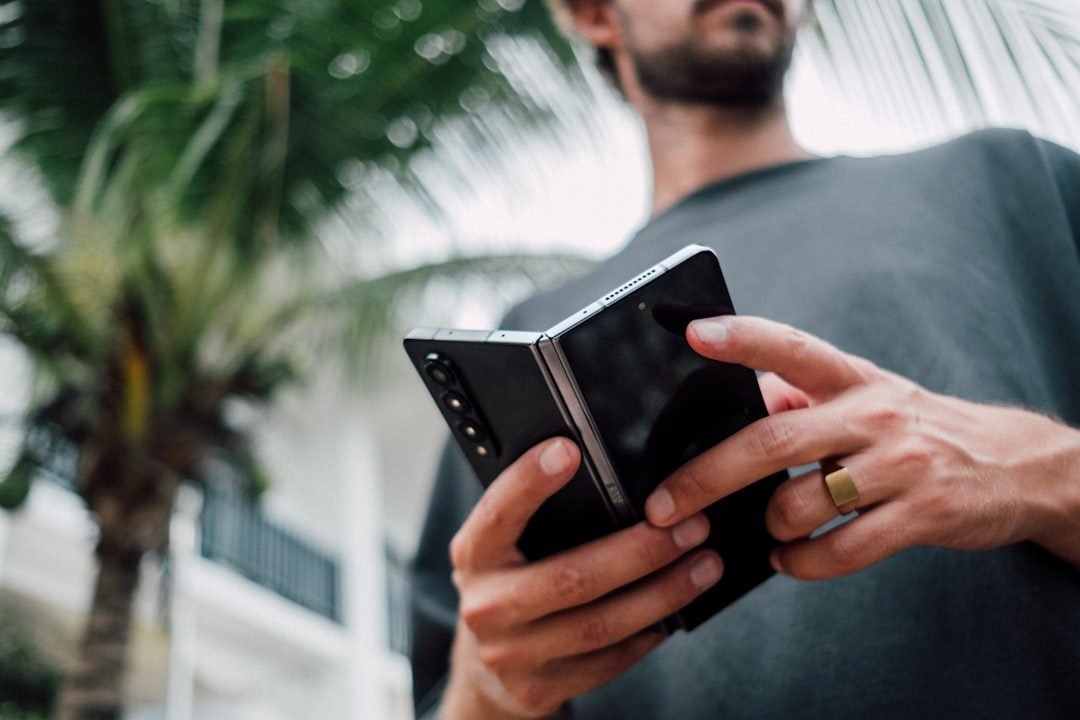 Person holding a smartphone, illustrative photo