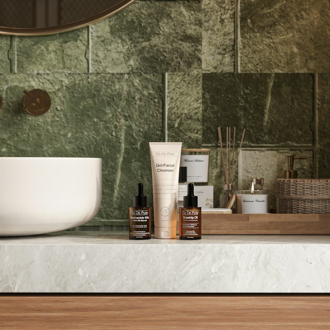 Skincare serum bottles on a marble bathroom counter