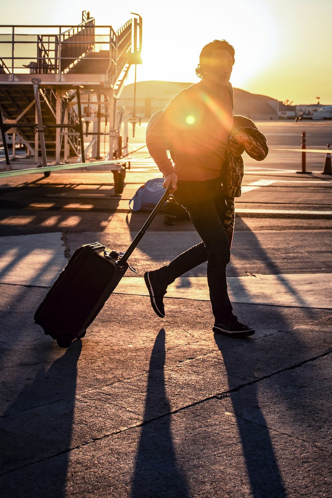 Traveler walking through an airport with luggage